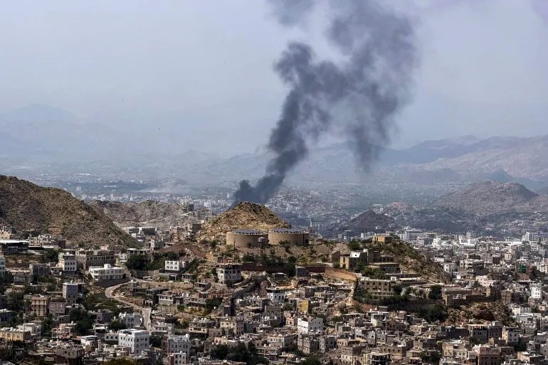 Smoke billows from a site that was targeted during battles between Saudi-backed Yemeni government fighters and Yemen's Iran-backed Houthis at the Jabal Han front, west of the city of Taiz, on October 21, 2026.