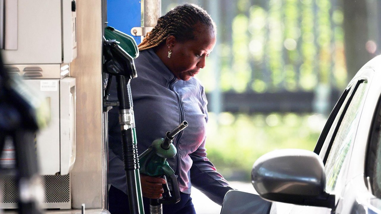 A woman filling up her car with petrol in London April 2026