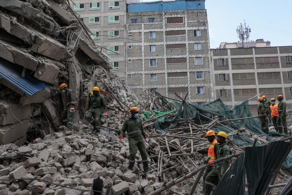 AFP journalists saw the building had been reduced to a pile of rubble as search and rescue teams arrived