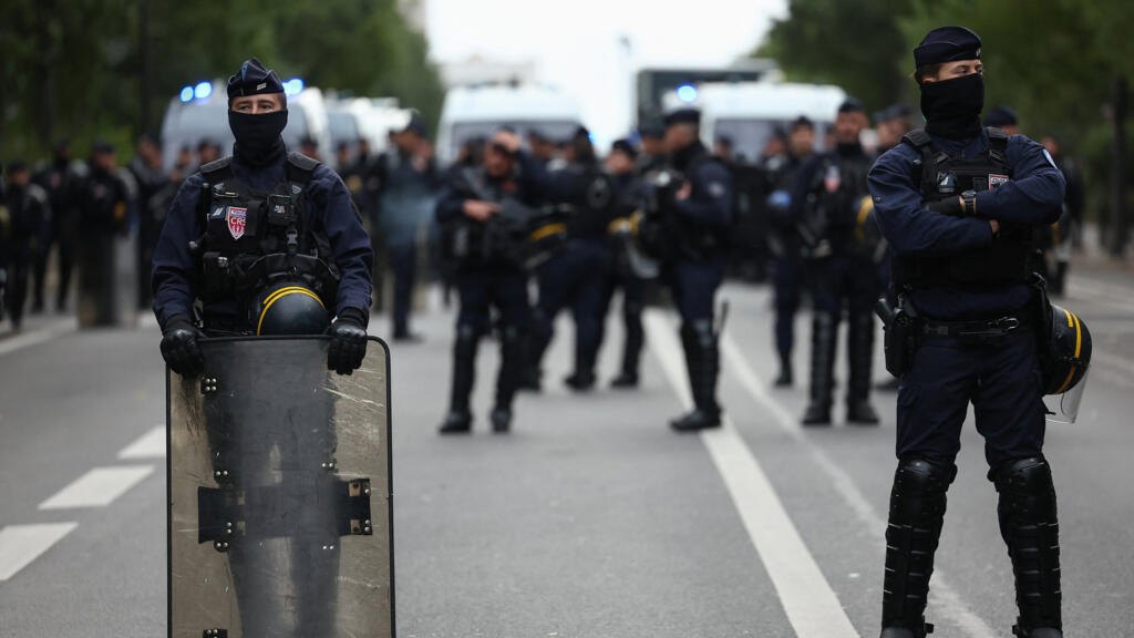 Officers of the French riot police stand guard during a protest organised by student collectives and trade unions in Paris, France, October 22, 2026.