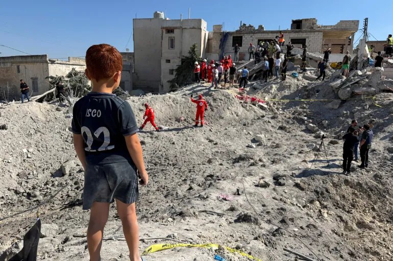 A child stands next to the rubble of a building damaged in an Israeli strike in Qennarit, southern Lebanon, June 20, 2026. Picture taken with a mobile phone. REUTERS/Stringer TPX IMAGES OF THE DAY
