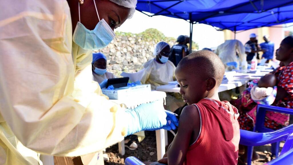 A healthcare worker administers a vaccine to a child in the city of Goma on 17 July 2019, during a previous Ebola outbreak in the Democratic Republic of Congo.
