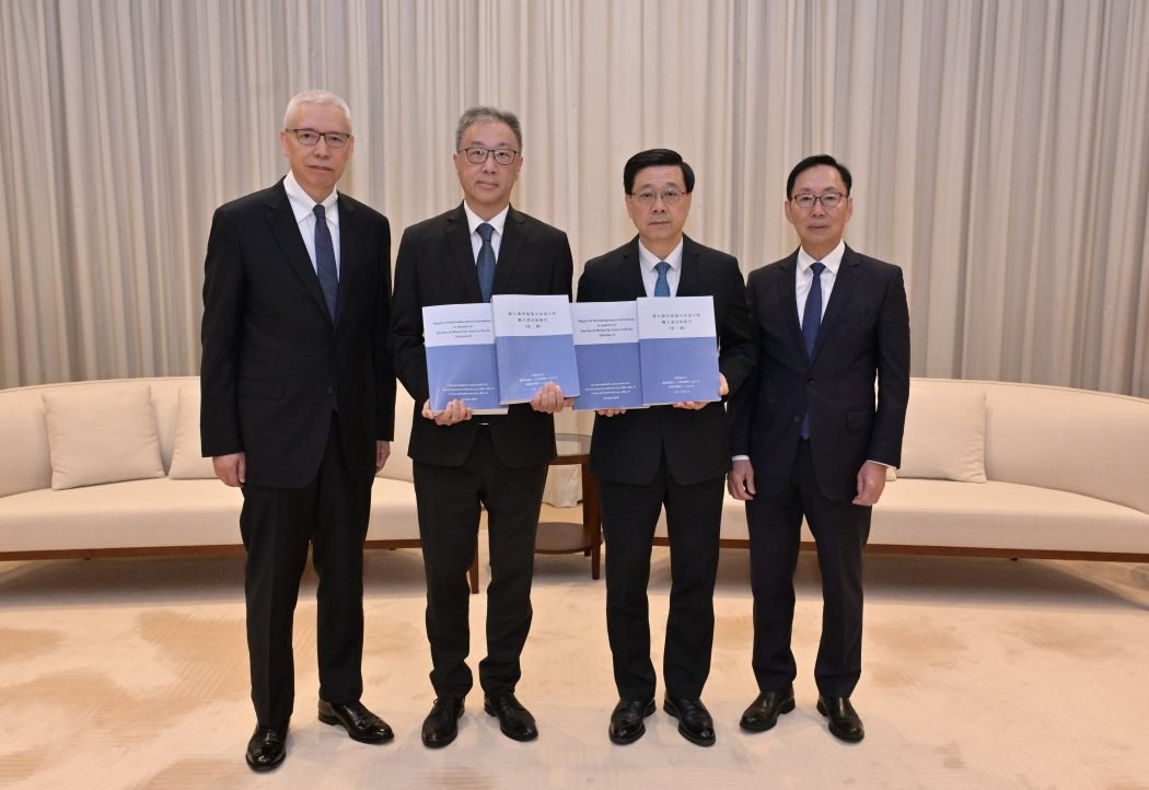 Members of the independent committee files the final report to city leader John Lee on October 22, 2026. Photo: GovHK.