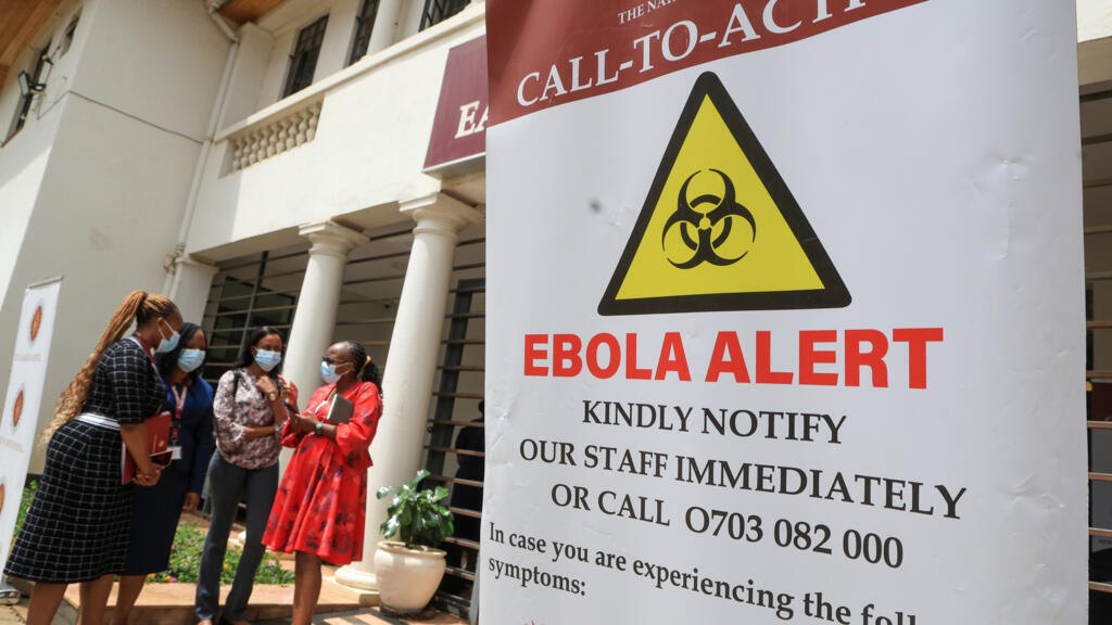 Healthcare professionals outside an isolation centre dedicated to the Ebola virus at a hospital in Nairobi, Kenya, 7 October.