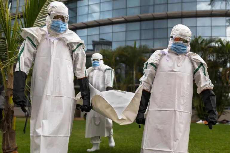 Kenya Red Cross personnel in Personal Protective Equipment (PPE) simulate the evacuation of remains of an Ebola victim in the Kenyan capital Nairobi on October 22, 2026.